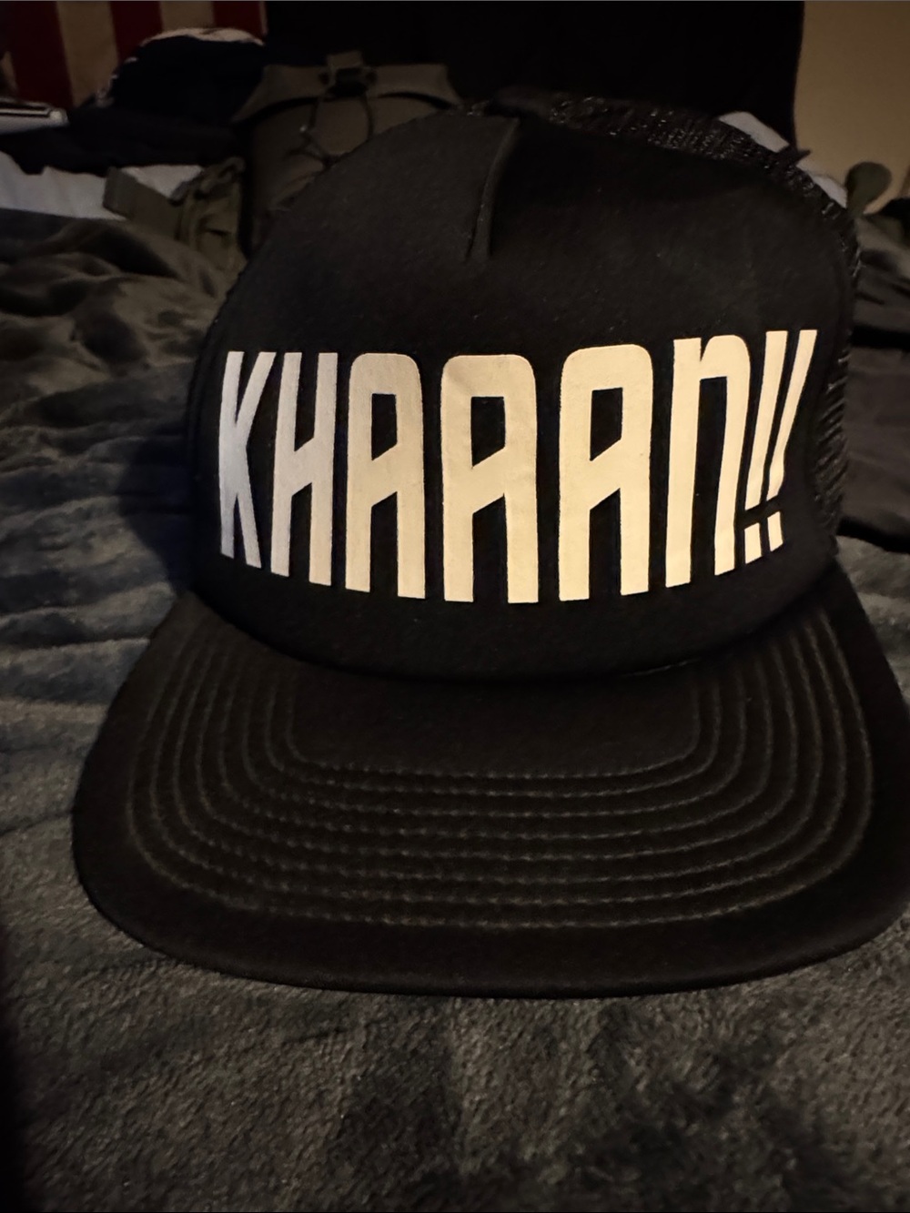 KHAAN!! Black Trucker Hat with Bold White Text